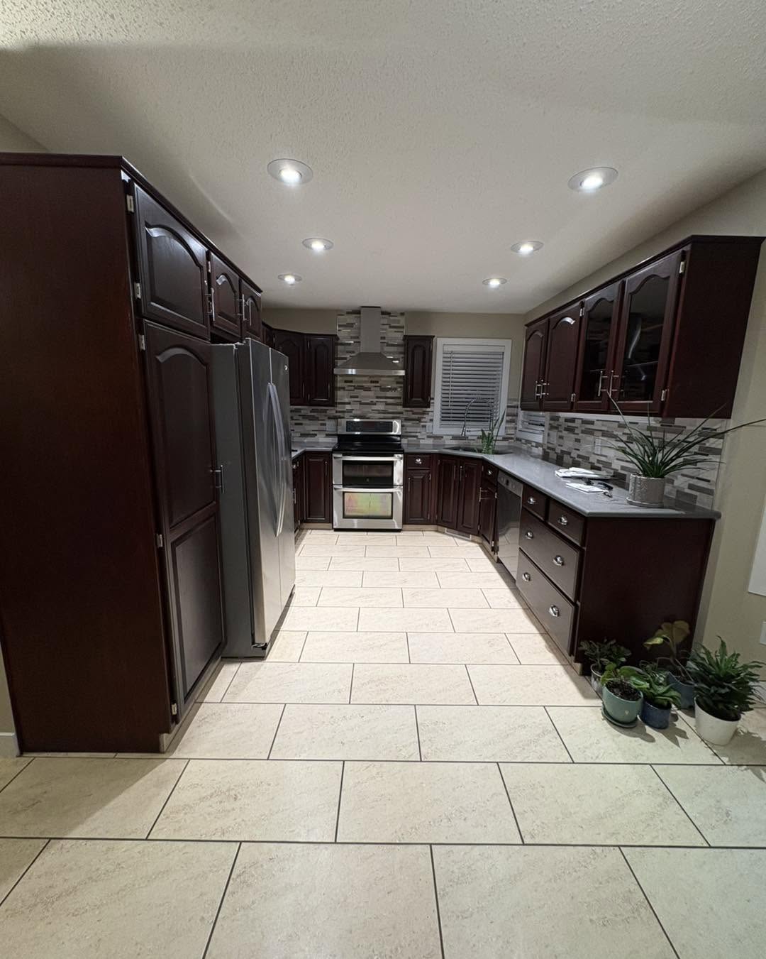 Quartz countertops and tile backsplash